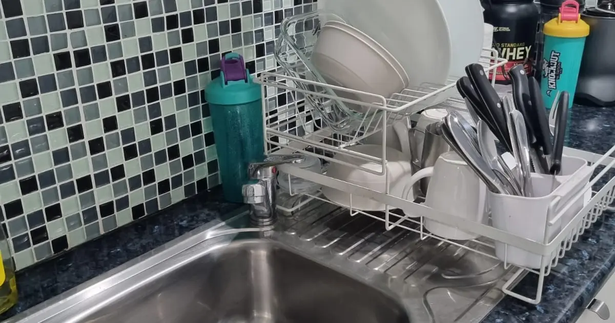 Commercial office kitchen and sink area requiring regular cleaning