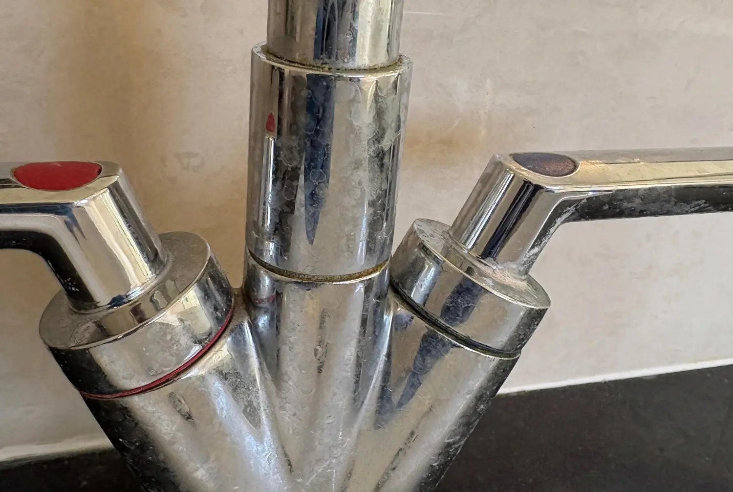 bathroom-tap-before-cleaning Bathroom tap before cleaning, showing visible residue and marks